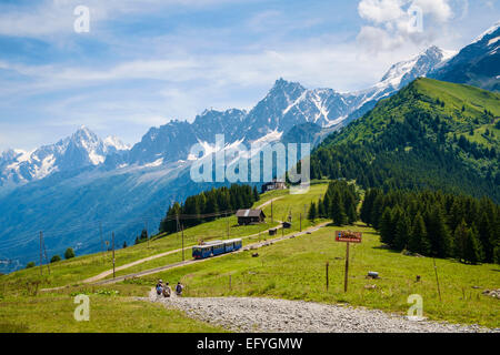 Walkers and Mont Blanc tramway cog train at Bellevue over Chamonix Valley, French Alps, France, Europe Stock Photo