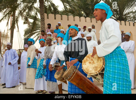 Omani musicians providing music for a tribal dance during the Muscat Festival in the Sultanate of Oman. Stock Photo