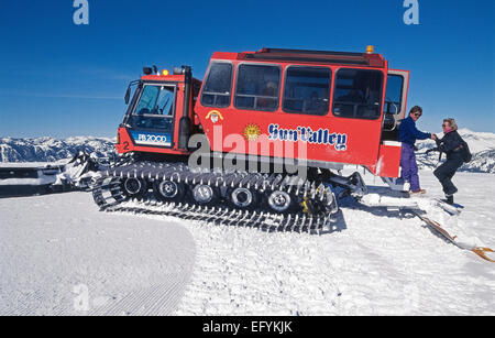 A snowcat vehicle takes visitors up snow-covered Bald Mountain for panoramic views of winter scenery at the resort town of Sun Valley in Idaho, USA. Stock Photo