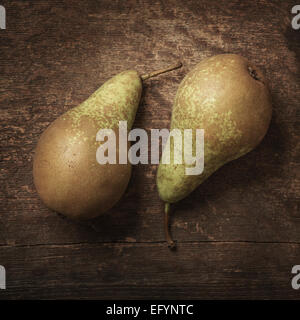 Still life of fresh pears on wooden surface Stock Photo