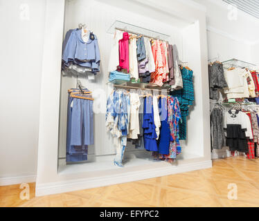 Children clothes on hangers in a room. wardrobe with boy's clothes on  hangers. Shopping and consumerism concept. Dressing closet with clothes  arranged Stock Photo - Alamy