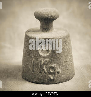 Still life of old fashioned iron weight of one kilogram used for measurement Stock Photo