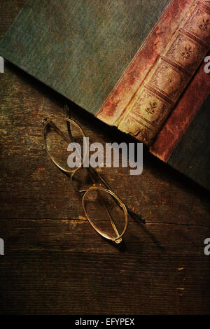 Still life with old book and glasses on wooden table. Top view. Stock Photo