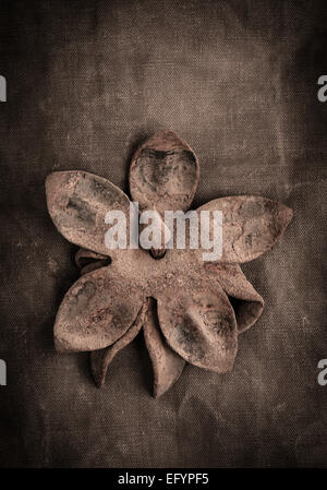 Still life of old rusty metal flower Stock Photo
