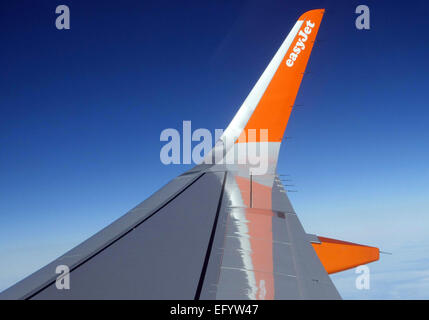 EasyJet logo on wingtip of Airbus A320 aircraft in flight Stock Photo