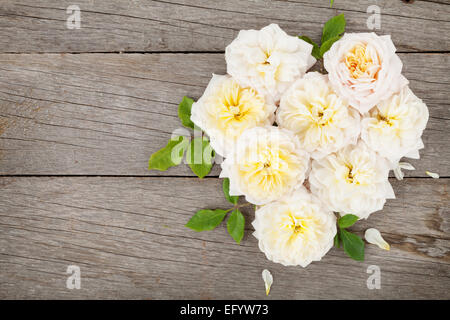 Heart shaped rose flowers on wooden table background with copy space Stock Photo