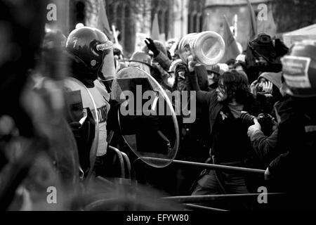 Students march and clashed with police and blocked the road around Westminster protesting against planned increases in tuition fees and maintenance grant cuts on November 24, 2010 in London, United Kingdom.This is the second student day of action and a student march on the 10th November caused widespread damage to Millbank Tower and the Metropolitan police were accused of greatly underestimating the amount of demonstrators. There are plans to raise the student tuition fees in England to around £9,000 a year instead of the current £3,000. Stock Photo