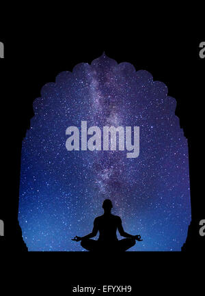 Meditation in old temple at night sky with Milky Way and stars Stock Photo