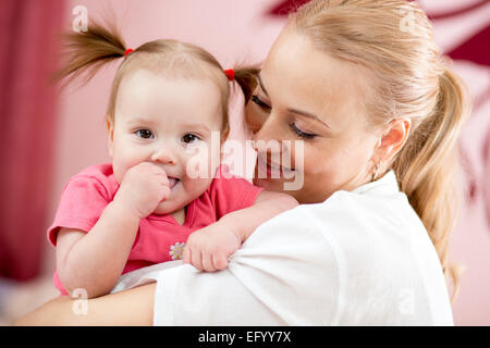 Portrait of a joyful mother and her baby daughter Stock Photo