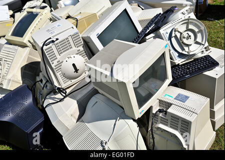 Pile of old computer monitors and keyboards Stock Photo