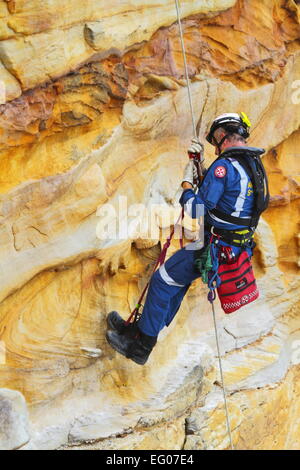 A male member of the Special Operations team, within the Ambulance Service of NSW, conduct abseiling and rappelling training. Stock Photo