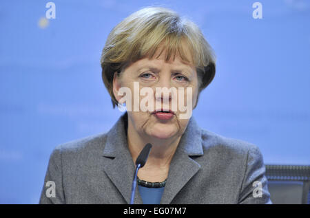 Brussels, Belgium. 12th Feb, 2015. German Chancellor Angela Merkel reacts during a press conference after EU summit at EU headquarters in Brussles, Belgium, Feb. 12, 2015. Credit:  Ye Pingfan/Xinhua/Alamy Live News Stock Photo