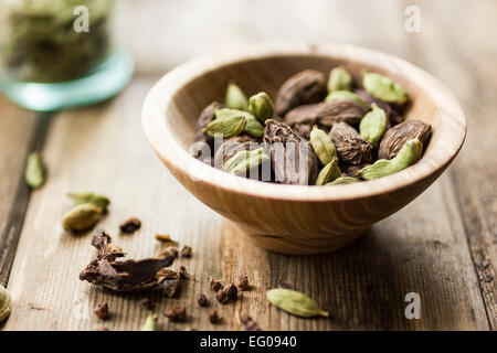 Black and green cardamom seed pods Stock Photo