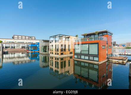 Floating houses homes modern houseboats house boats water villas in Amsterdam IJburg Yburg district. Rising sea level project. Stock Photo