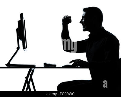 one caucasian business man computer computing happy portrait silhouette in studio isolated on white background Stock Photo