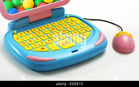 Close up Colored Plastic Computer with Mouse Toy on White Table. Stock Photo