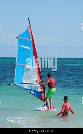 DOMINICAN REPUBLIC. A young man learning to windsurf at Punta Cana beach. 2015. Stock Photo