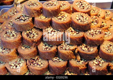 Tray of Burma Baklava, the traditional turkish sweet made with shredded fillo dough wrapped around a pistachios Stock Photo