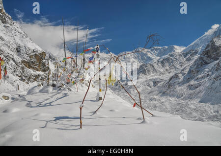 Buddhist prayer flags in Himalayas near Kanchenjunga, the third tallest mountain in the world Stock Photo