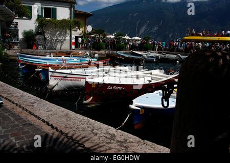 View of parts of the bay with boats and ferry port of Limone sul Garda. Limone sul Garda is located on the western shore of Lake Garda in the province of Brescia, Lombardy, Italy. Photo: Klaus Nowottnick Date: August 28, 2014 Stock Photo