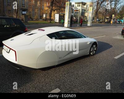 A Volkswagen VW XL1 one liter car driving in a street in Berlin on December 06, 2014. Photo: Wolfram Steinberg/dpa Stock Photo