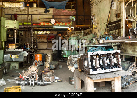 Vietnamese mechanic working in his workshop in Kon Tum, Asia Stock Photo