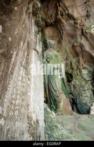 The statue of Buddha ( goddess of compassion and mercy - Guanyin ) in Marble mountain, Da Nang, Vietnam. Stock Photo