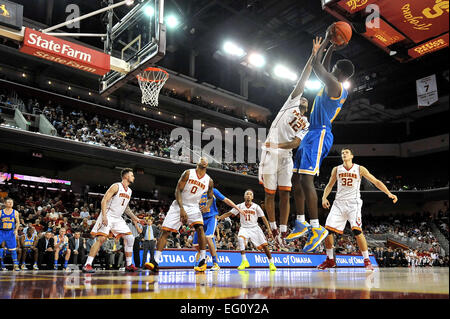 Los Angeles, CA, USA. 14th Jan, 2015. UCLA Bruins guard Isaac Hamilton #10 shoots the ball over USC Trojans guard Julian Jacobs #12 in the second half in action during the College Basketball game between the UCLA Bruins and the USC Trojans at the Galen Center in Los Angeles, California.The UCLA Bruins defeat the USC Trojans 83-66. © csm/Alamy Live News Stock Photo