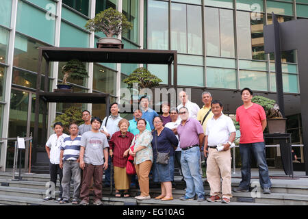 Philippine Bonsai Society (5th from left front row) and Bonsai Club International (BCI) President Mr. Thomas S. Elias (7th from left back row) with other bonsai lovers taking a picture beside the “Giant Mame Bonsai” was set-up by Philippine Bonsai Society (PBSI) in front of Ayala Museum in Makati City as part of the February Art Month. PBSI are promoting the bonsai in the Philippines and they are announcing that in 2016 the organization will be hosting Bonsai Club International (BCI) Show in Philippines. © Gregorio B. Dantes Jr./Pacific Press/Alamy Live News Stock Photo