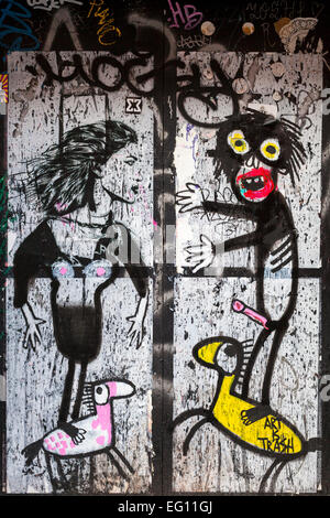 Graffiti street art on a painted over window in Brick Lane, East London Stock Photo