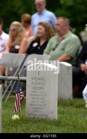 The headstone of Master Sgt. Michael George Heiser rests at Arlington National Cemetery, Va., near family members and friends gathered at a remembrance ceremony on Sunday, June 25, marking the 10th anniversary of the Khobar Towers bombing.  Nineteen Airmen were killed in the terrorist bombing at Dhahran Air Base, Saudi Arabia, on June 25, 1996.   Tech. Sgt. Cohen A. Young Stock Photo