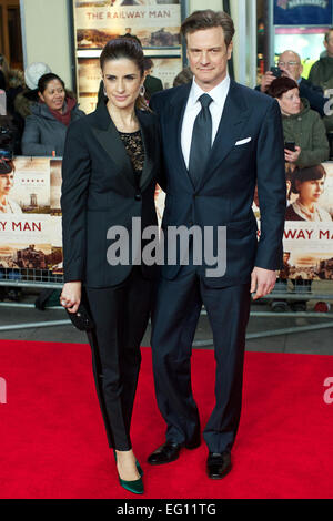 UNITED KINGDOM, London : British Actor Colin Firth and Italian film producer Livia Giuggioli poses for pictures on the red carpet upon arrival for the UK premier of the film 'The Railway man' in Leicester Square, central London, on December 4, 2013. Stock Photo