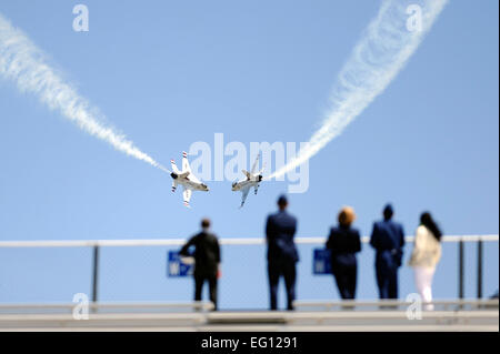 The U.S. Air Force Thunderbrids execute a manuever while visitors watch from Falcon Stadium after the graduation ceremonies of the  Class of 2009.  This was the 51st graduating class, and consisted of 1,046 newly commissioned 2nd Lieutenants US Air Force photo/Dennis Rogers Stock Photo