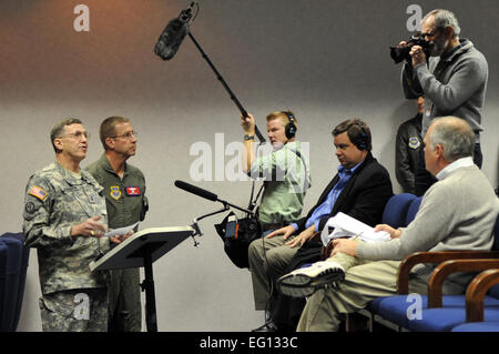 SCOTT AIR FORCE BASE, Ill - Army Maj. Gen. William H. Johnson, United States Transportation Command Chief of Staff, left, and Maj. Gen. Mark Solo, 618th Tanker Airlift Control Center TACC commander, give a press conference from the 618th TACC, Jan. 14 2010. Maj. Gens. Johnson and Solo spoke with the media regarding Team Scott's involvement with the relief efforts in Haiti.  Senior Airman Teresa M. JenningsRelesed Stock Photo