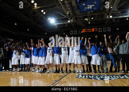 U.S. Air Force Academy, CO- Members of the Falcons and fans raise their hands in celebration of their win over the Wyoming Cowboys at Clune Arena 30 Jan. They won 70-63. This win broke a 22-game conference losing streak for the Falcons; their first win in the Mountain West Conference since March 5, 2008.  J. Rachel Spencer Stock Photo