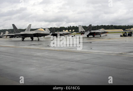 F-22’s assigned to the 3rd Wing taxi to the main runway during Red Flag Alaska Aug. 18. Reserve and Active Duty pilots and maintainers assigned to the 477th Fighter Group and 3rd Wing, respectively, integrate in nearly all areas of F-22 operations. U.S. Air Force/Capt. Ashley Conner Stock Photo