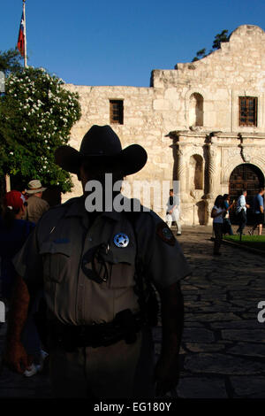 Alamo Ranger David Garcia stands guard at the Alamo in San Antonio, Texas, as tourists visit the site Oct. 26, 2010.  The Alamo was built by the Spanish Empire in 1744 and originally was comprised of a sanctuary and the surrounding buildings. Staff Sgt. Jonathan Pomeroy Stock Photo