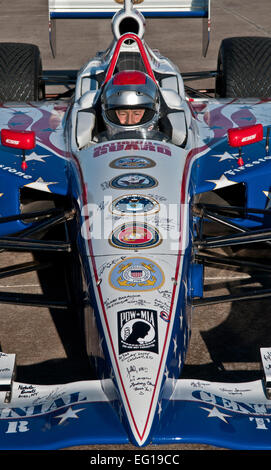 Four-time Indianapolis 500 race winner Mario Andretti  prepares to give a demonstration ride to Airmen during the Indy 500 Centennial Tour Jan. 19, 2011, at Incirlik Air Base, Turkey. More than 30 individuals were chosen to ride in the Indy 500 race car. The Indy 500 Centennial Tour, coordinated by Morale Entertainment Foundation and Armed Forces Entertainment, in conjunction with the IZOD Indy Car Series and the Indianapolis Motor Speedway, is a 10-day morale trip to Europe and the Middle East with the goal of boosting the morale of more than 10,000 service members. The team, which includes I Stock Photo