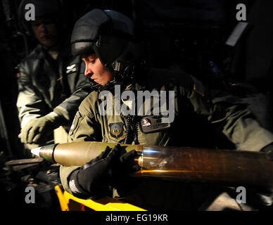 U.S. Air Force AC-130U gunship aerial gunner Staff Sgt. Sarah Mrak from the 4th Special Operations Squadron loads the 105 mm gun Feb. 3, 2011, during a local training mission at Hurlburt Field, Fla. The AC-130U &quot;Spooky&quot; gunship is the primary weapon of Air Force Special Operations Command. Its primary missions are close air support, air interdiction and armed reconnaissance. The U model is an upgraded version of the H and is equipped with side firing, trainable 25 mm, 40 mm, and 105 mm guns.  Master Sgt. Jeremy T. Lock Stock Photo