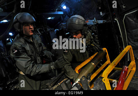 U.S. Air Force AC-130U gunship aerial gunner Staff Sgt. Nick Harrison from the 4th Special Operations Squadron loads the 105 mm gun Feb. 3, 2011, during a local training mission at Hurlburt Field, Fla. The AC-130U &quot;Spooky&quot; gunship is the primary weapon of Air Force Special Operations Command. Its primary missions are close air support, air interdiction and armed reconnaissance. The U model is an upgraded version of the H and is equipped with side firing, trainable 25 mm, 40 mm, and 105 mm guns.  Master Sgt. Jeremy T. Lock Stock Photo