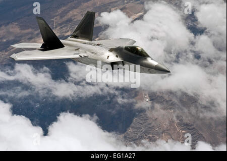 A U.S. Air Force F-22 Raptor, 3rd Fighter Wing, Elmendorf Air Force Base, Alaska, flies over the Nevada Test and Training Range for a training mission during Red Flag 11-3, March 2, 2011. Red Flag is a realistic combat training exercise involving the air forces of the United States and its allies. The exercise is hosted north of Las Vegas on the Nevada Test and Training Range. Senior Airman Brett Clashman Stock Photo