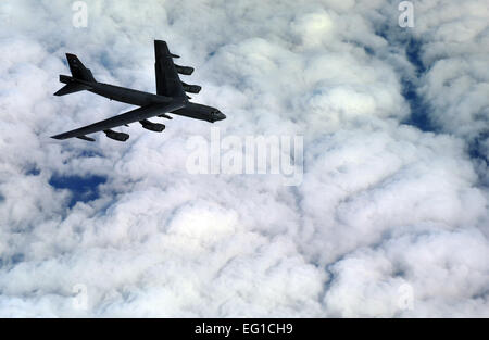 A U.S. Air Force aircrew assigned to the 23rd Bomb Squadron from Minot Air Force Base N.D., flies an Air Force B-52 Stratofortress bomber aircraft on an eight-hour sortie going over bomb dropping sequences and air refueling, April 20, 2011. Pilots, navigators, radar and electronic warfare officers make up the B-52 crew. Putting bombs on target and providing close air support are two of the several missions accomplished by the huge aircraft out of Minot.  Staff Sgt. Andy M. Kin Stock Photo