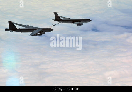 A U.S. Air Force Air Force B-52 Stratofortress bomber aircraft, crewed by members of the 23rd Bomb Squadron from Minot Air Force Base N.D., gets refueled while on an eight-hour sortie going over bomb dropping sequences and air refueling April 20, 2011. Pilots, navigators, radar and electronic warfare officers make up the B-52 crew. Putting bombs on target and providing close air support are two of the several missions accomplished by the huge aircraft out of Minot.  Staff Sgt. Andy M. Kin Stock Photo