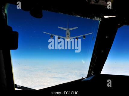 A U.S. Air Force Air Force B-52 Stratofortress bomber aircraft, crewed by members of the 23rd Bomb Squadron from Minot Air Force Base N.D., prepares to get refueled while on an eight-hour sortie going over bomb dropping sequences and air refueling April 20, 2011. Pilots, navigators, radar and electronic warfare officers make up the B-52 crew. Putting bombs on target and providing close air support are two of the several missions accomplished by the huge aircraft out of Minot.  Staff Sgt. Andy M. Kin Stock Photo