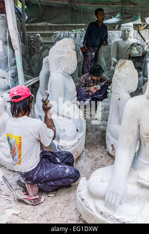 Myanmar, Mandalay, marble workers prepearing Buddha statues. Stock Photo