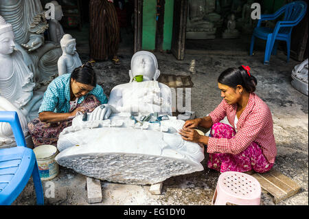 Myanmar, Mandalay, marble workers prepearing Buddha statues. Stock Photo
