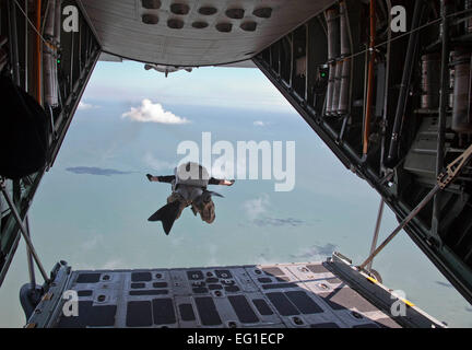 A pararescueman from the 920th Rescue Wing RQW at Patrick Air Force Base, Fla., free falls from a HC-130P/N King refueling aircraft at 3,500 feet during a Cocoa Beach Air Show demonstration Nov. 4, 2011. The Cocoa Beach Air Show will feature 920th RQW Reserve rescue Airmen, HC-130P/N King aircraft and HH-60G Pave Hawk helicopters Nov. 5-6. Pararescuemen are able to perform life-saving missions in the world's most remote areas, by air, land or water.  by Mike Brown Stock Photo