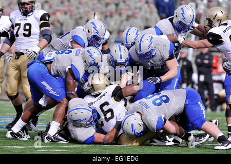 U.S. Air Force Academy Falcon defenders swarm Black Knights running back Larry Dixon in the Air Force-Army game at Falcon Stadium in Colorado Springs, Colo., Nov. 5, 2011. The Falcons capitalized on five Army turnovers to defeat the Black Knights, 24-14.  Raymond McCoy Stock Photo