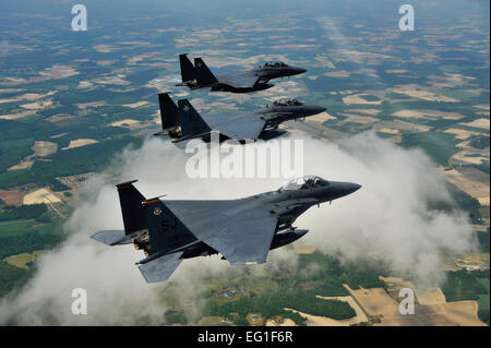 U.S. Air Force F-15E Strike Eagle fighter aircraft from the 4th Fighter Wing fly in formation during a Turkey Shoot training mission near Seymour Johnson Air Force Base, N.C., April 16, 2012.  The wing generated nearly 70 aircraft to destroy more than 1,000 targets on bombing ranges across the state to commemorate the 4th Fighter Wing's victory over the Luftwaffe April 16, 1945.  by Staff Sgt. Eric Harris Stock Photo