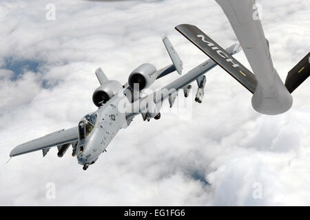An A-10C Thunderbolt II departs after completing air-to-air refueling from a KC135 Stratotanker while over Michigan, Sept. 13, 2013. Both units are assigned to the Michigan Air National Guard and stationed at Selfridge Air National Guard Base, Mich. The A-10 is assigned to the 107th Fighter Squadron. The KC-135 is assigned to the 171st Air Refueling Squadron. U.S. Air National Guard photo/Master Sgt. David Kujawa Stock Photo